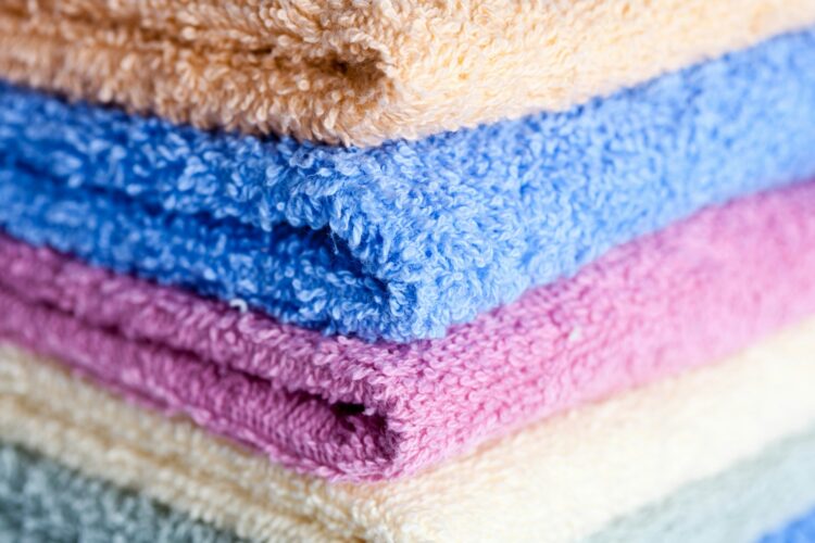 A stack of multicolored towels stacked on top of each other