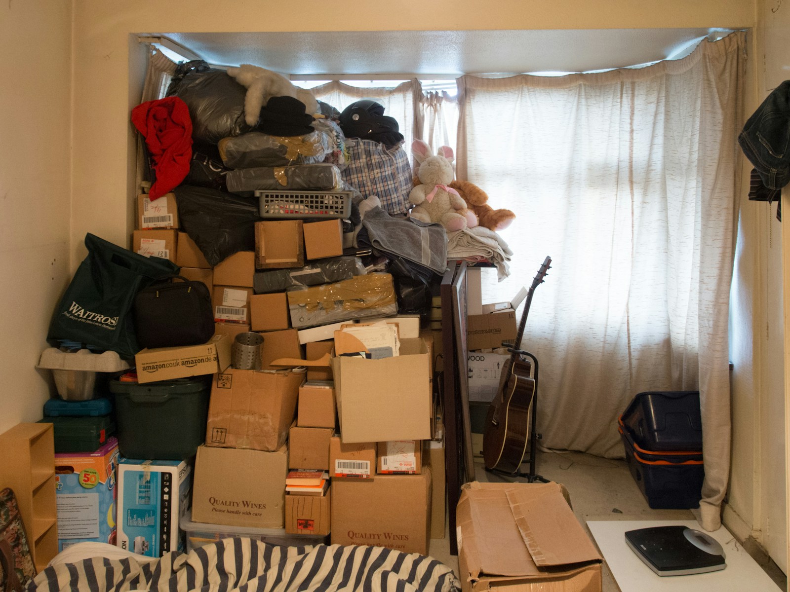 Brown cardboard boxes on black steel rack