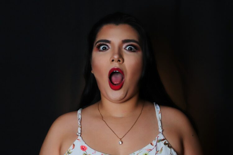 Woman in white and red floral tank top