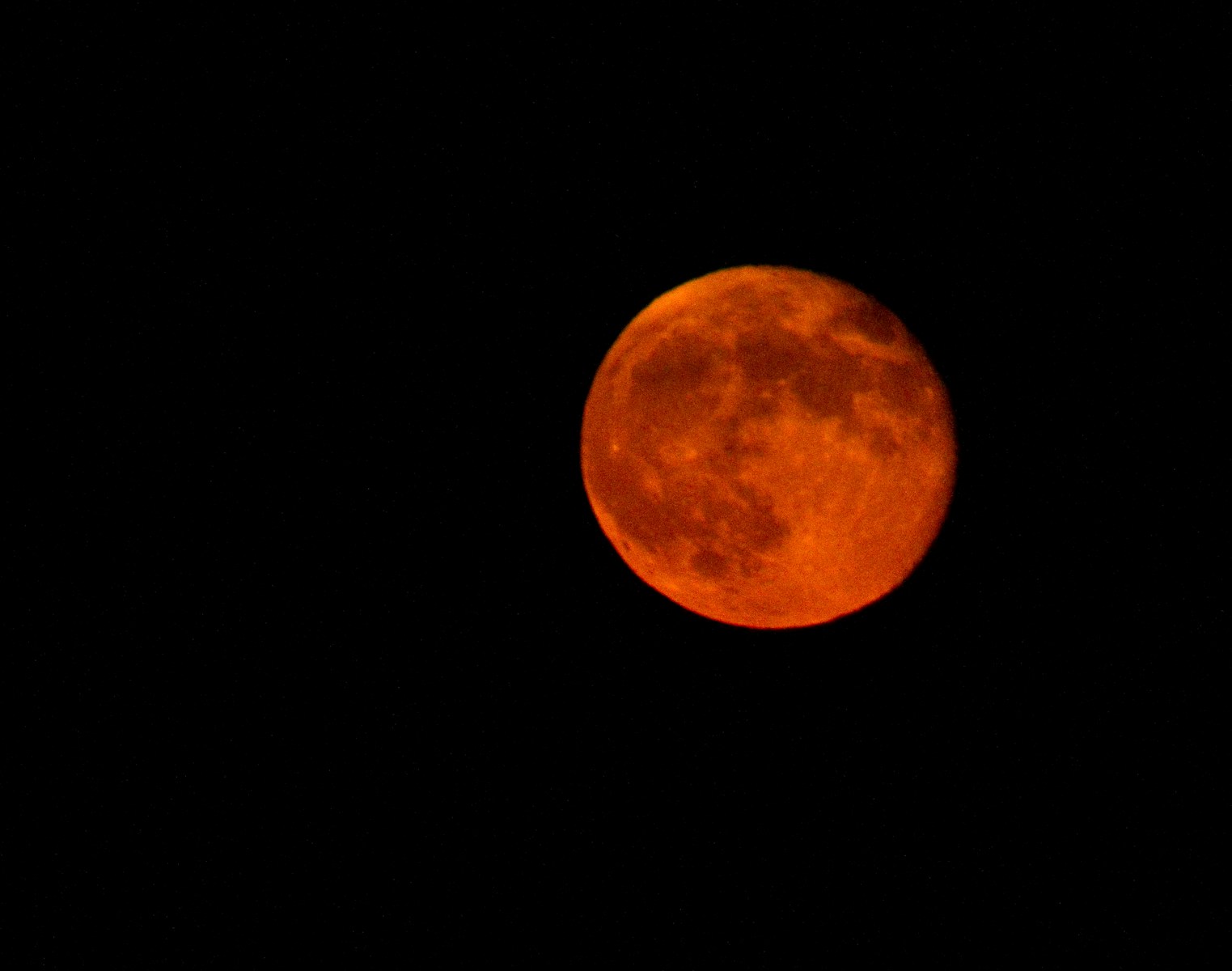 Full moon in dark night sky