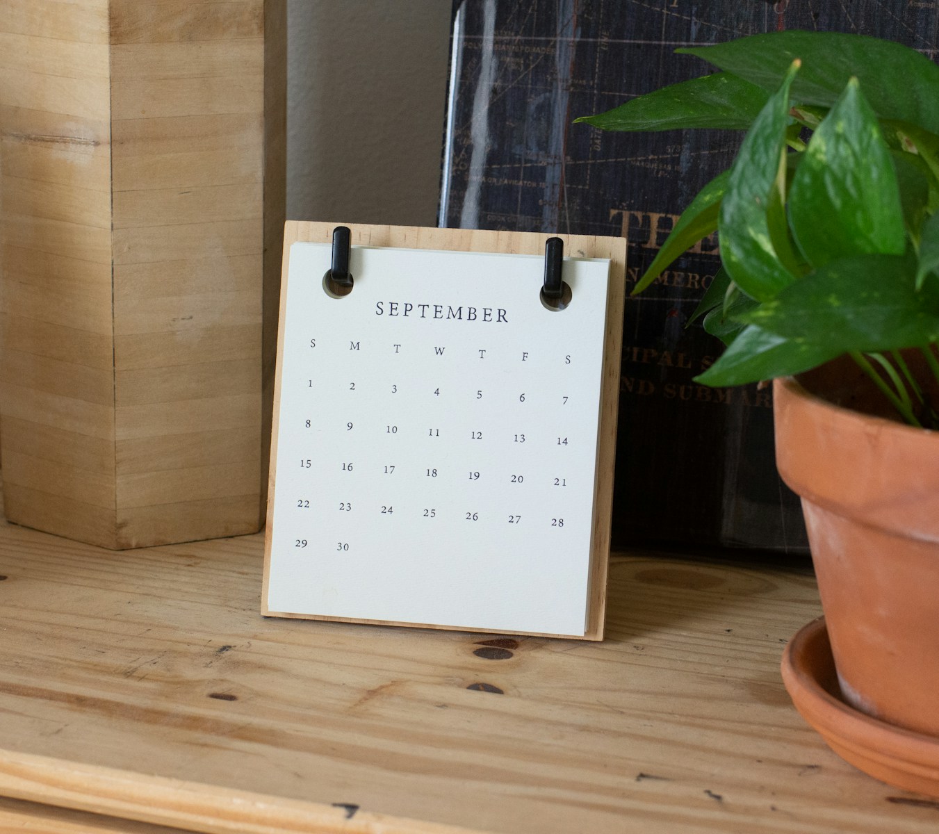 White braille paper on brown wooden table
