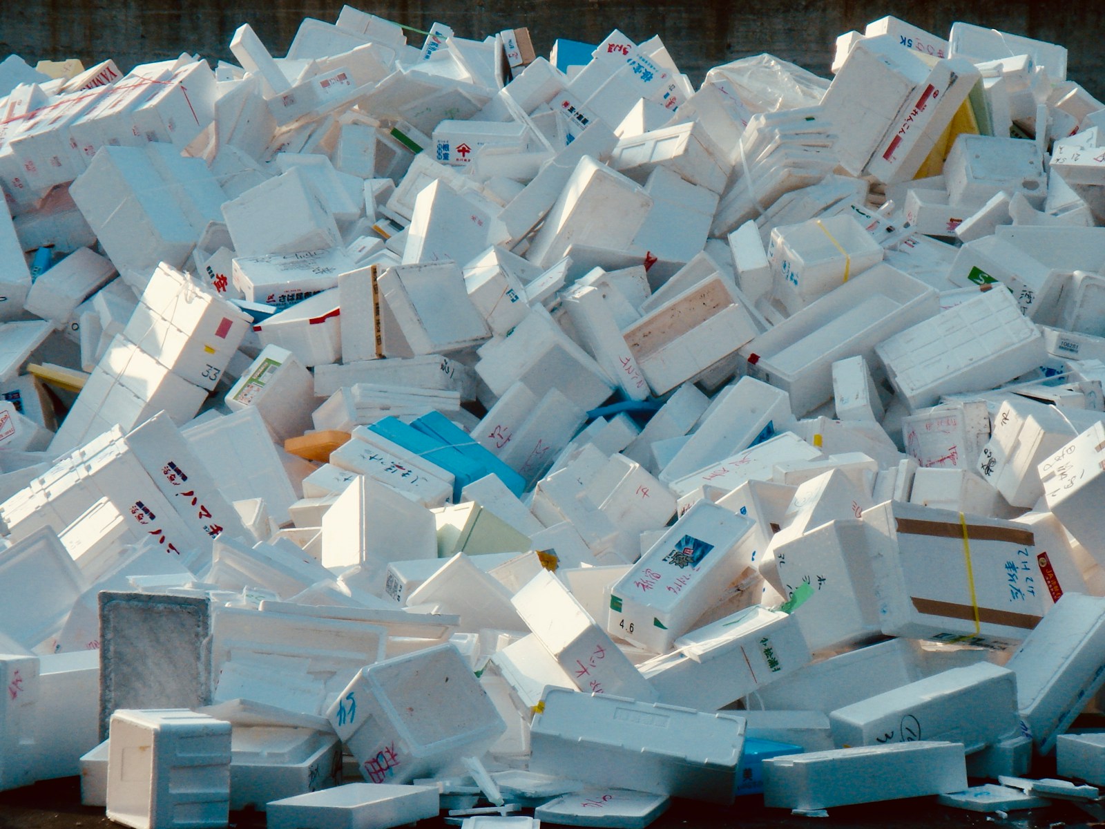 A pile of white boxes stacked on top of each other