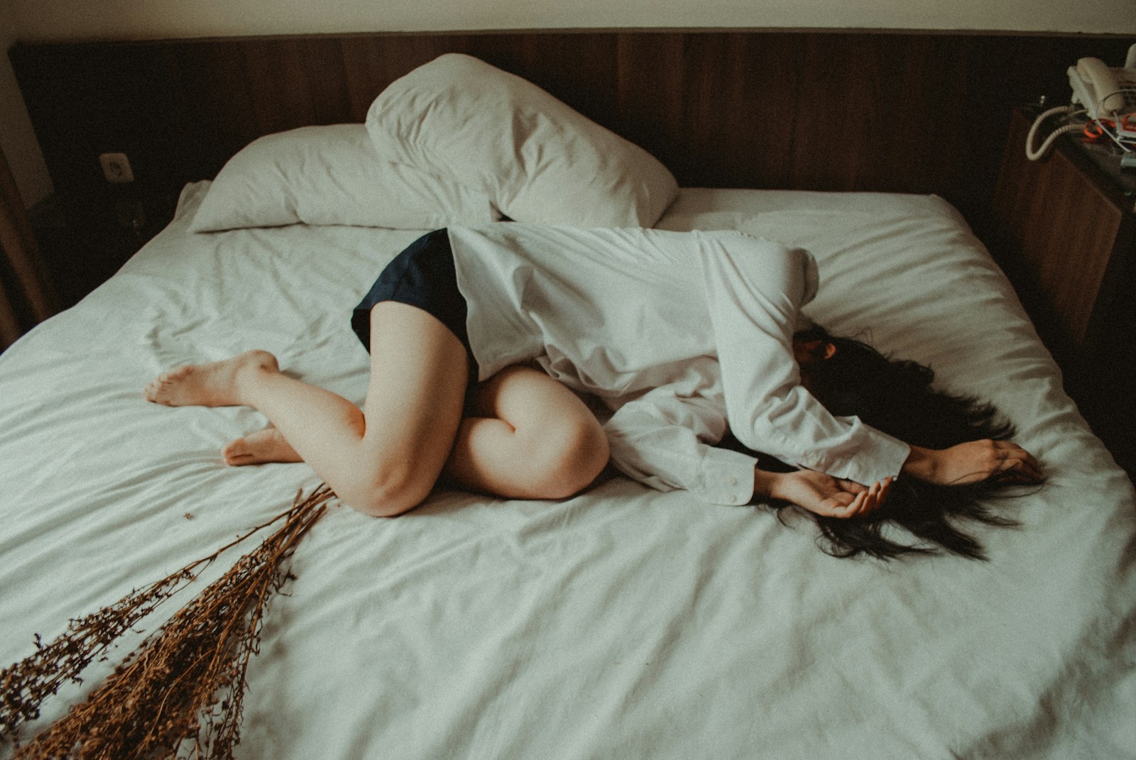 Woman lying on bed