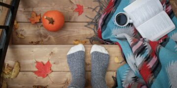 person wearing gray sock standing on stairs
