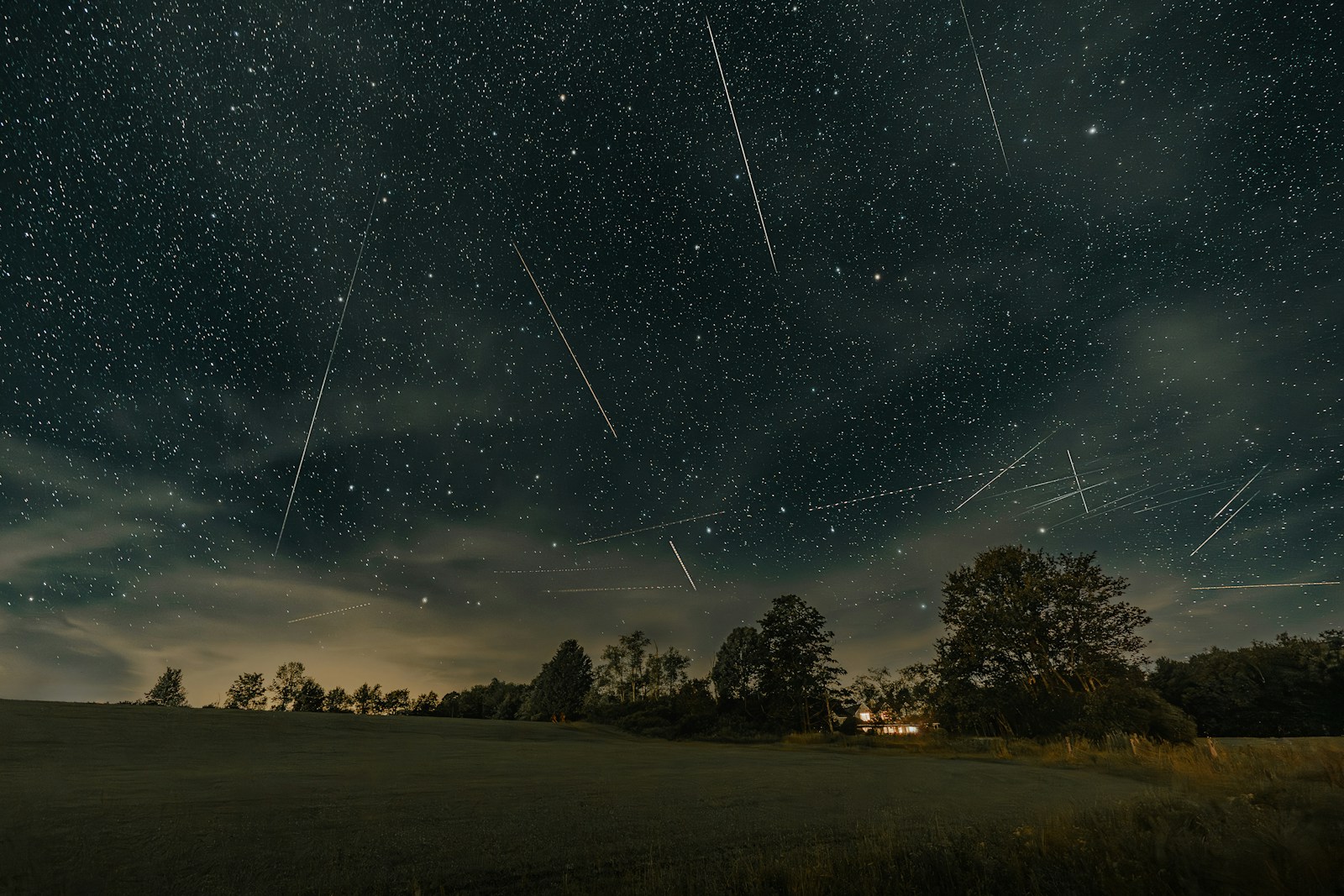 A night sky filled with stars and shooting stars