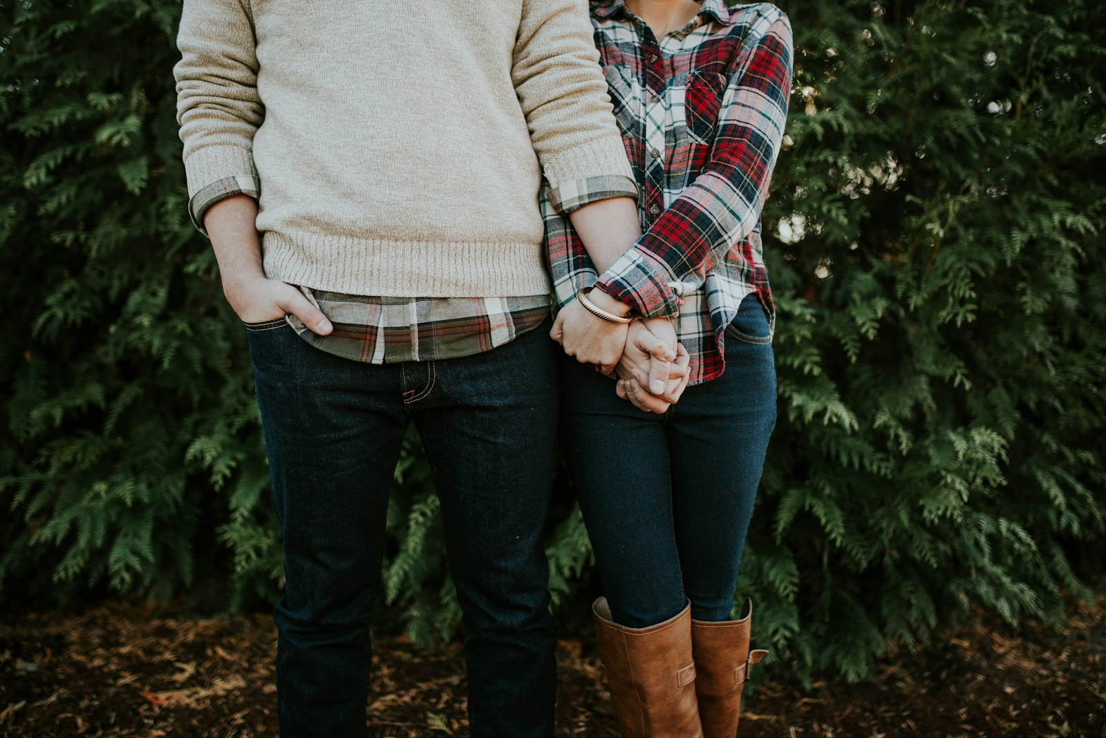 Woman holding man hand