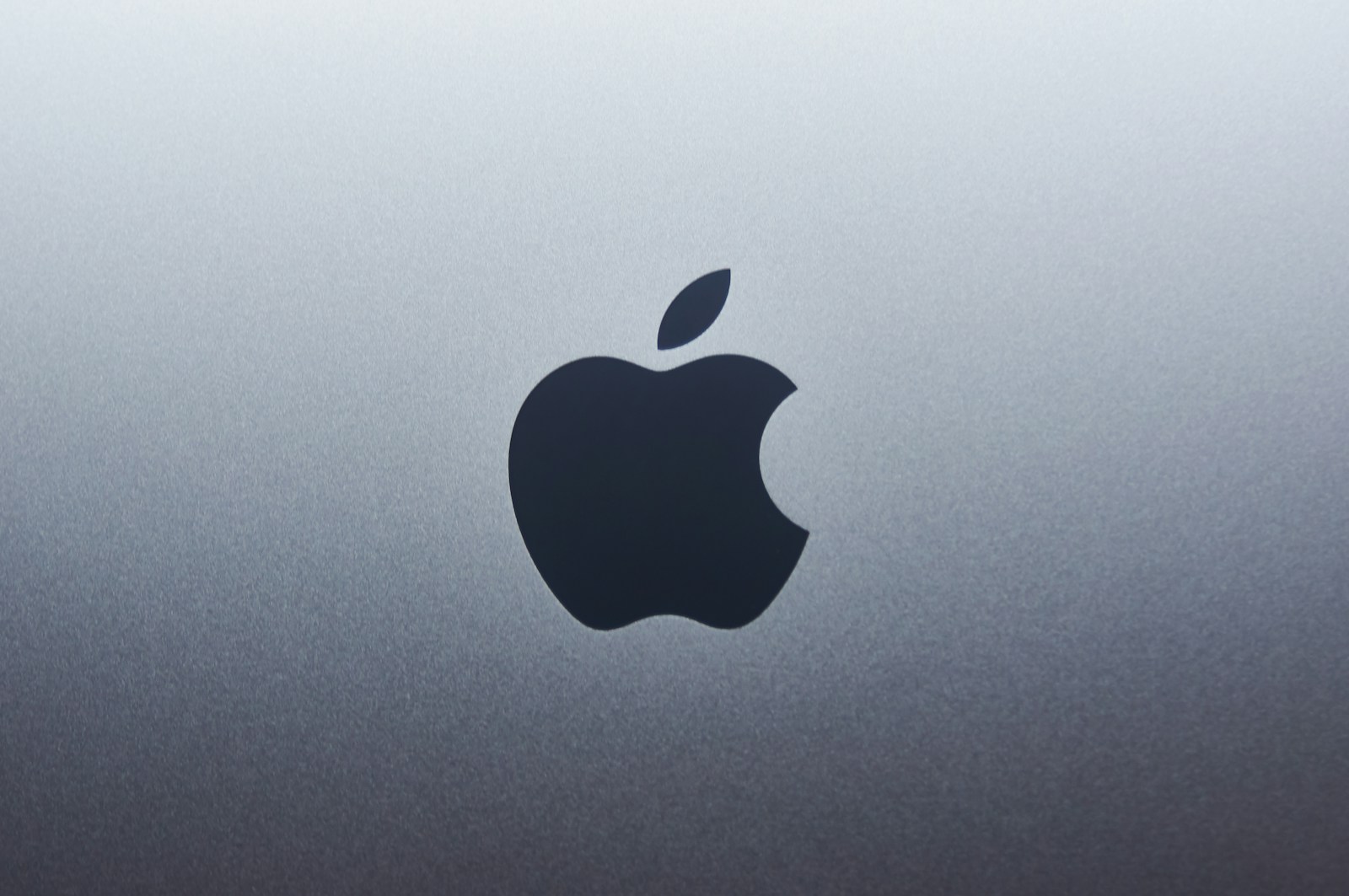Apple logo on blue surface