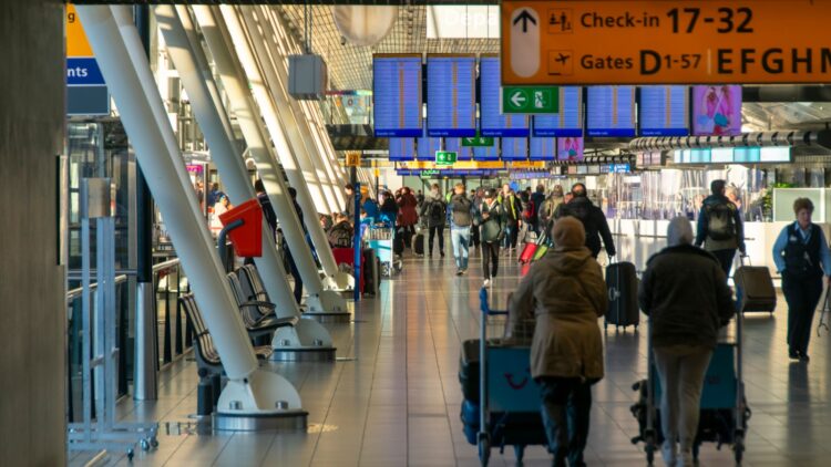 A group of people walking through an airport