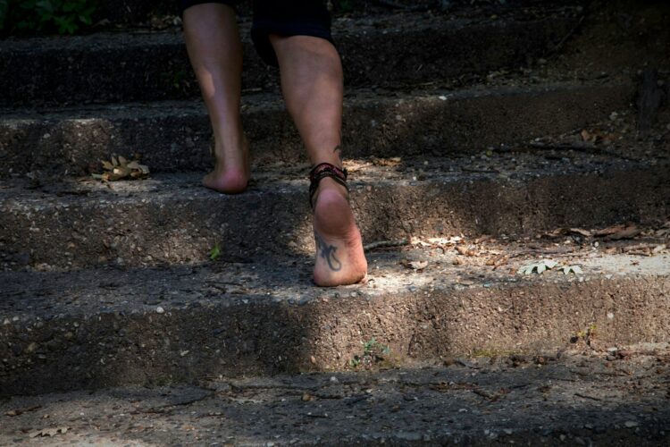 A person walking up a set of stairs