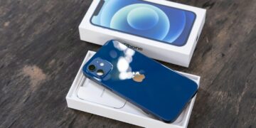 blue and white card on brown wooden table