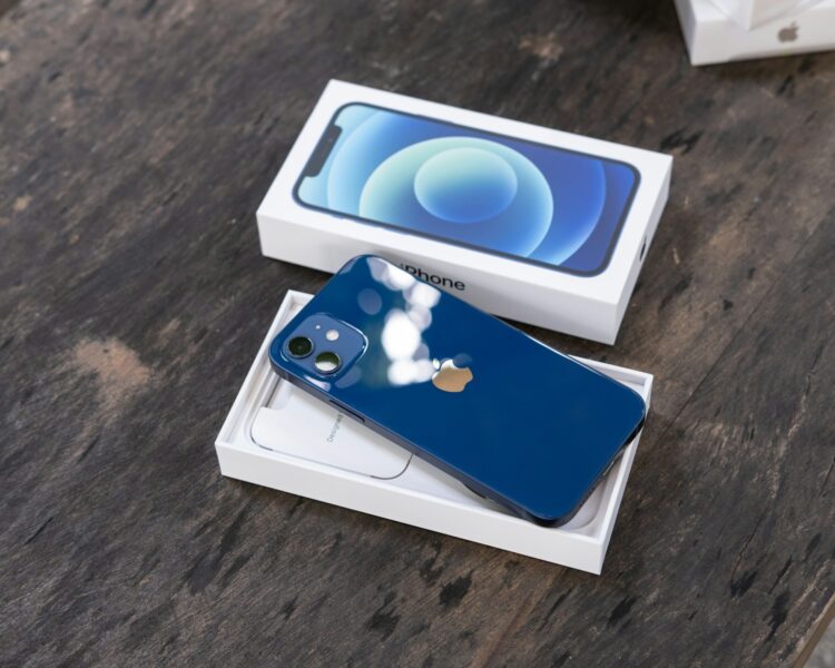 Blue and white card on brown wooden table