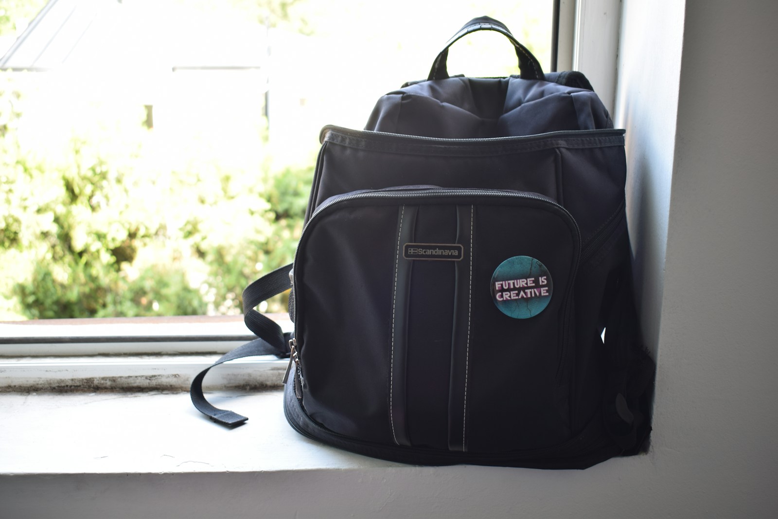 Black leather backpack on white table