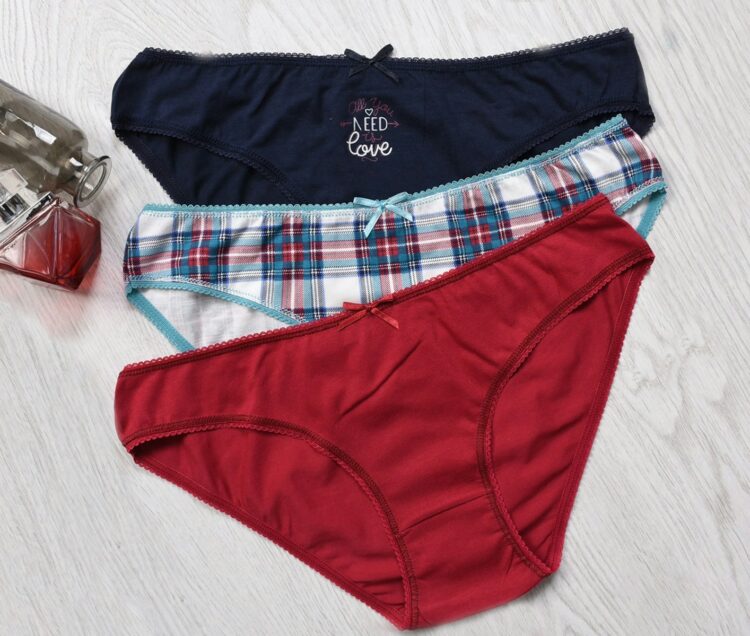 A pair of underwear sitting on top of a wooden floor