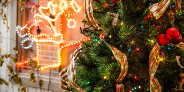 green and red Christmas tree near yellow neon light