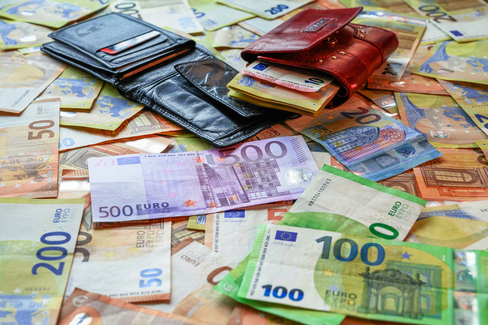 A pile of money sitting on top of a table