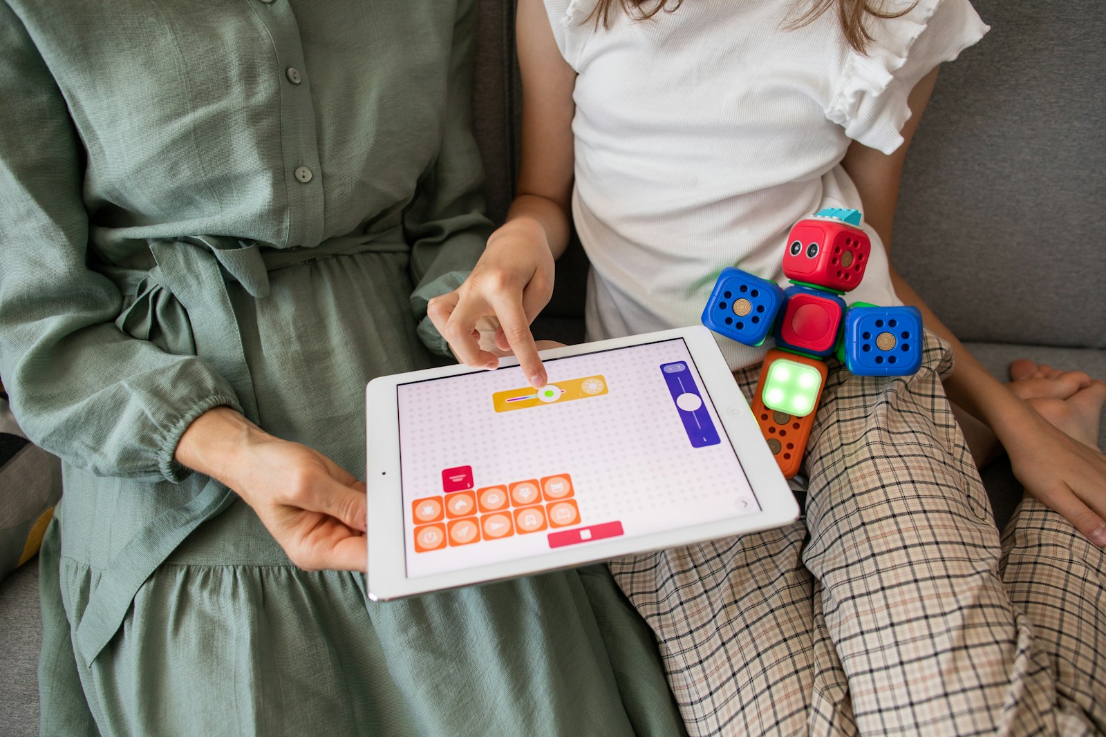 Child playing game on white ipad