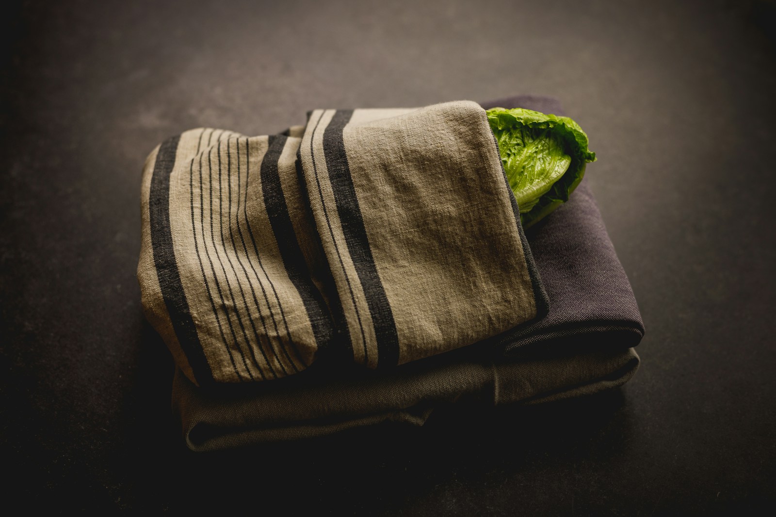 A towel with a green leaf on top of it