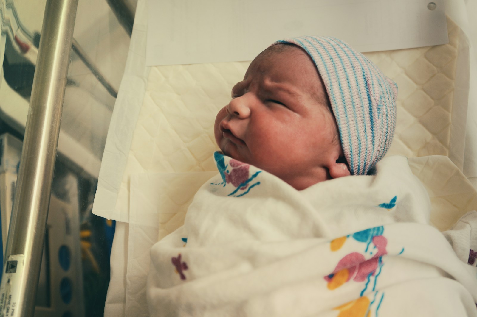 Baby in white knit cap