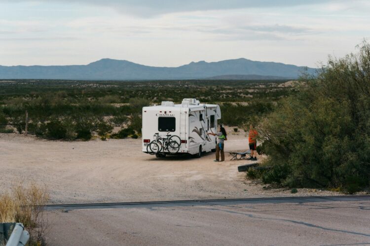 Man standing beside truck