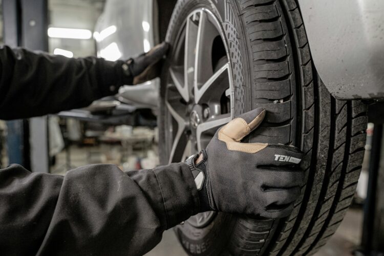 A man working on a tire in a garage