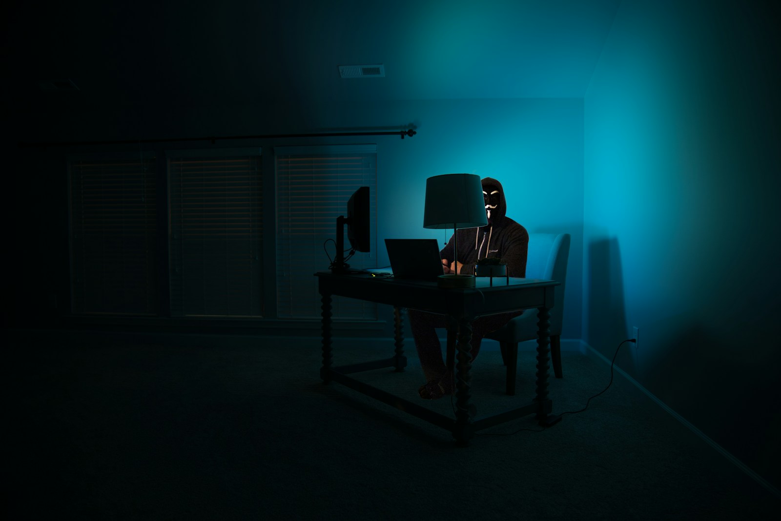 Man siting facing laptop