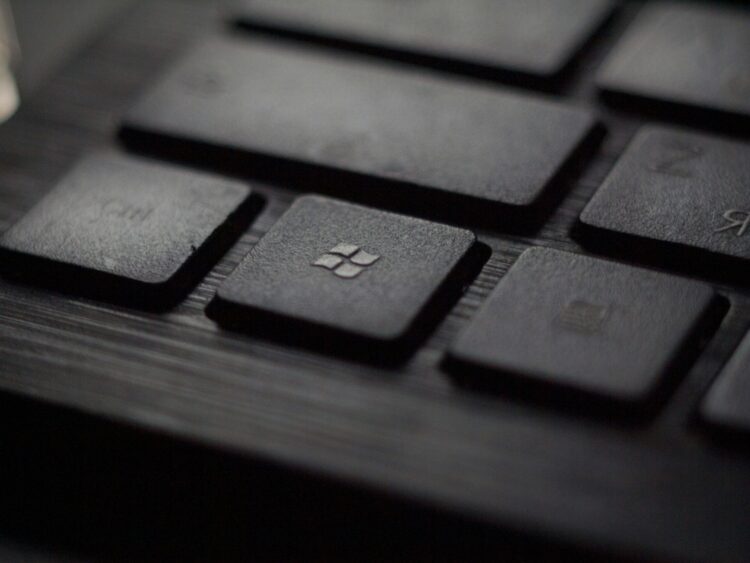 Black laptop computer keyboard in closeup photo