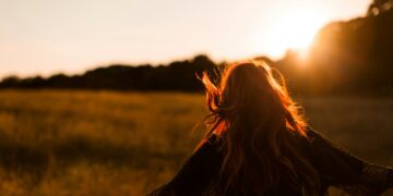 woman standing on grass field