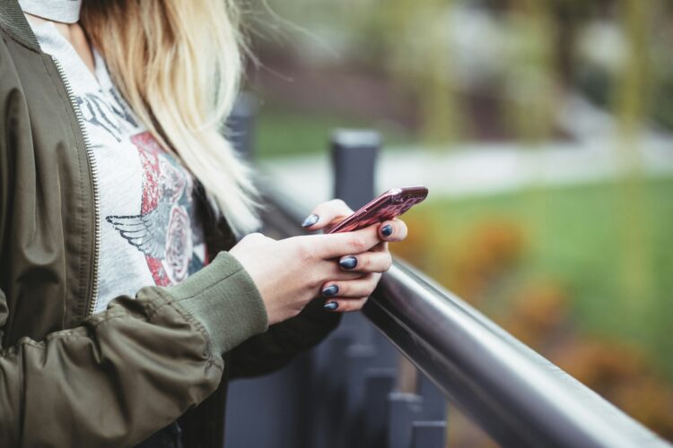 Woman holding red phone