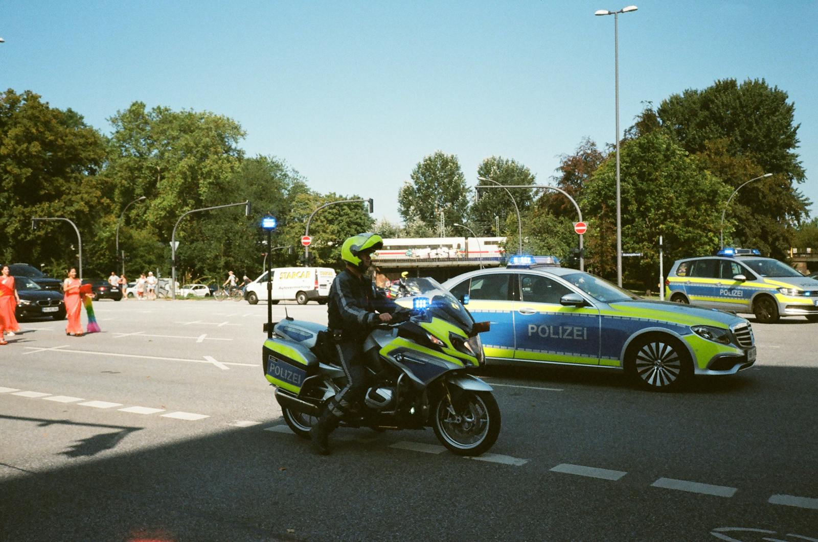 Photo by Darya Sannikova - Info Vandaag German police presence with cars and motorcycle during daytime traffic control