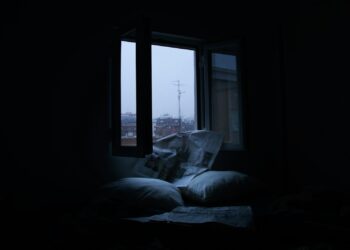 White bed linen on bed