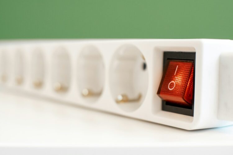 A close up of a red light on a white device