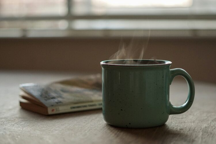 White ceramic mug on white table