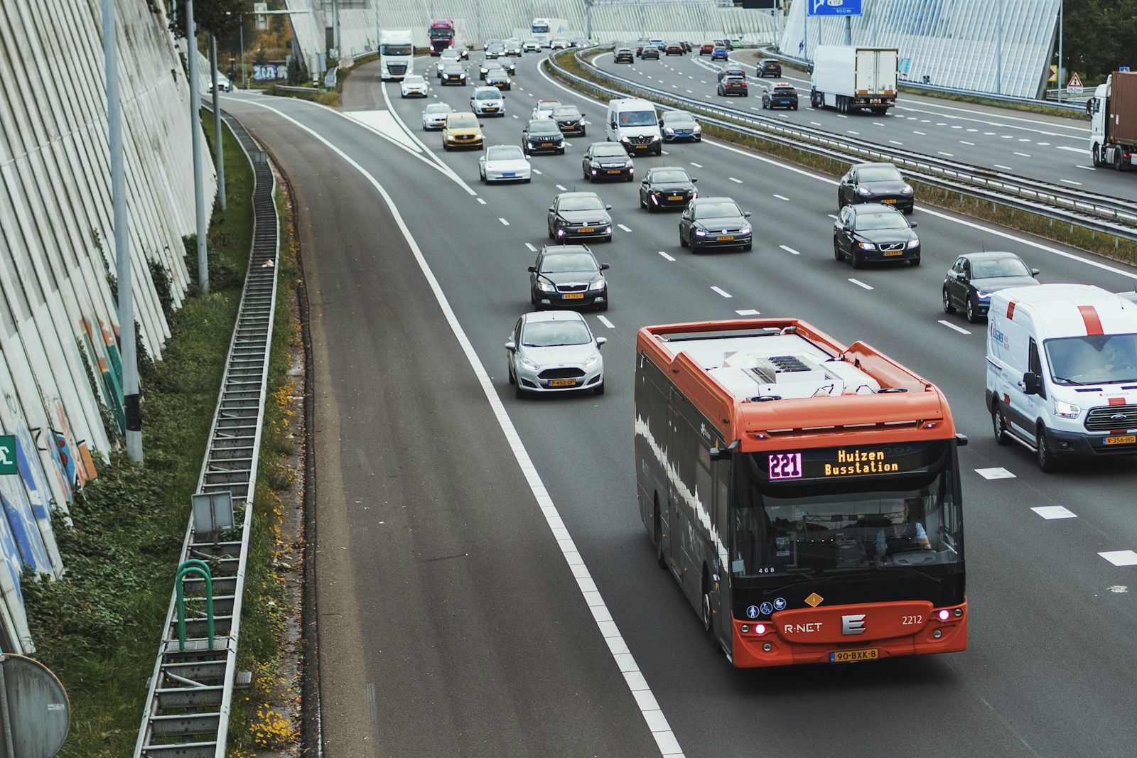 Traffic on a multi lane highway with a bus
