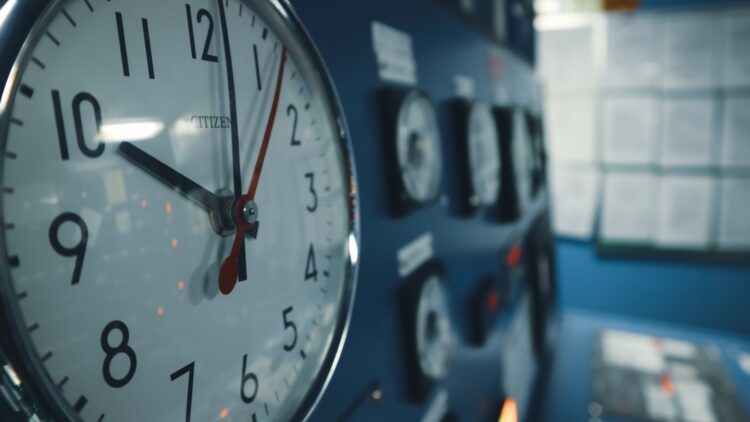 A close up of a clock on a wall