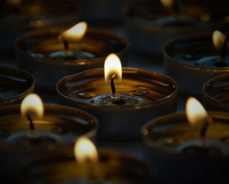 Selective focus photography of candle