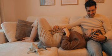 a man and a woman laying on a couch