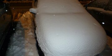 white car on road during night time