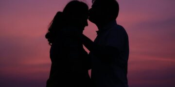a man and a woman standing next to each other