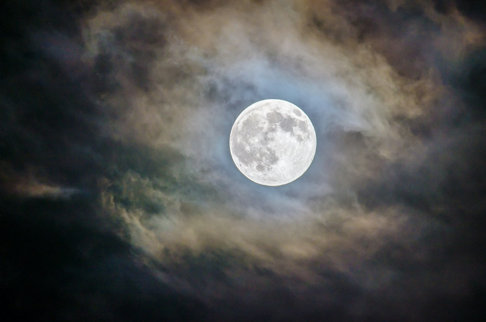 Full moon and gray clouds during nighttime