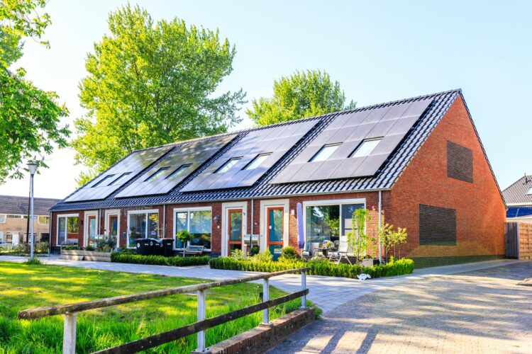 A house with a lot of solar panels on the roof