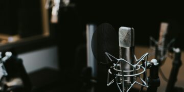 macro photography of silver and black studio microphone condenser