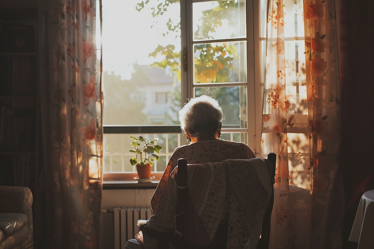 ai generative Grandma sitting facing the window graphic - Info Vandaag