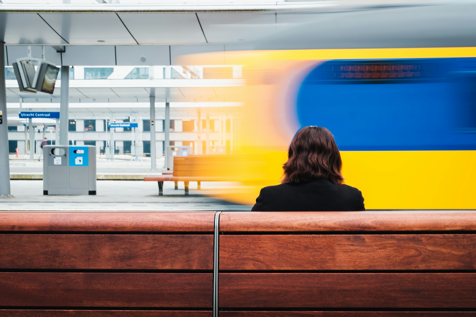 Woman sitting on train station