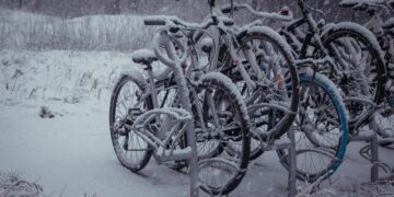 a bunch of bikes that are sitting in the snow