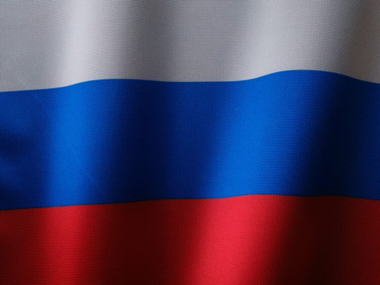 A close up of a red white and blue flag