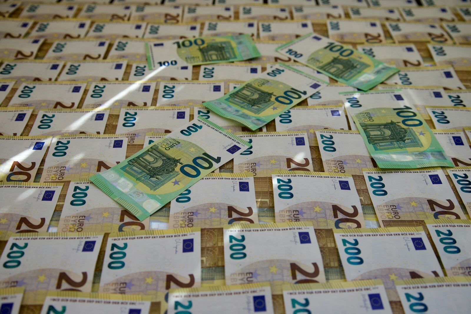 Photo by Stock Birken - Info Vandaag A pile of money sitting on top of a table