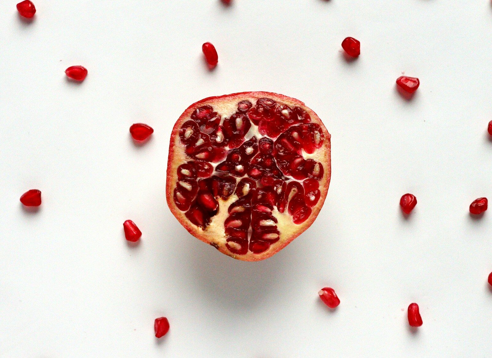 Photo by Priyanka Singh - Info Vandaag Red sliced fruit on white surface