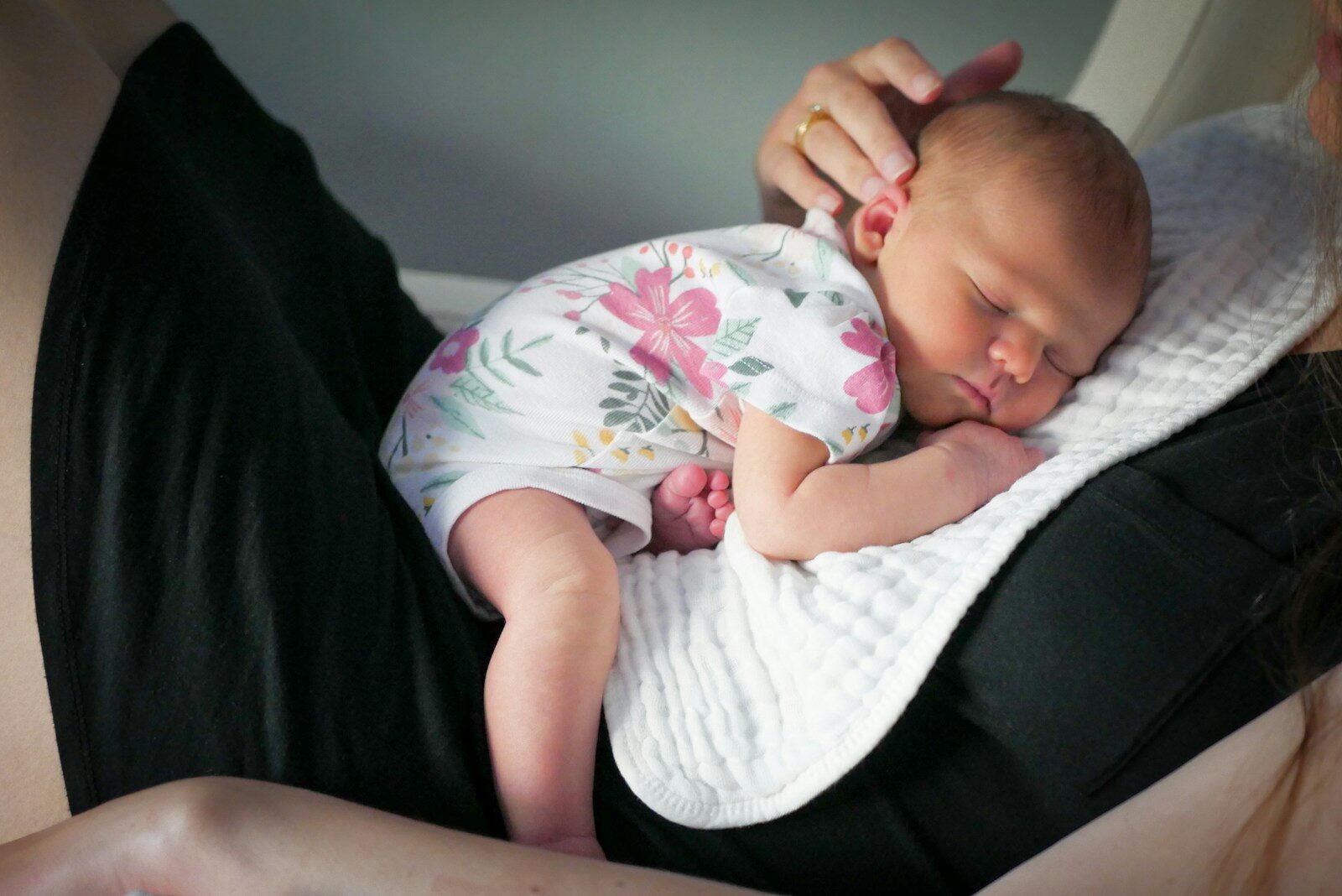 A woman holding a baby in her arms