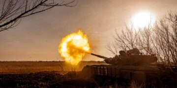 a tank that is on fire in a field