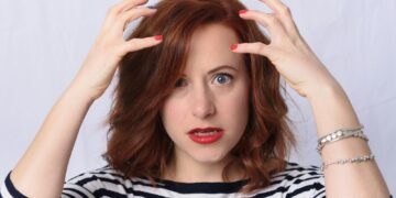 woman in black and white striped long sleeve shirt